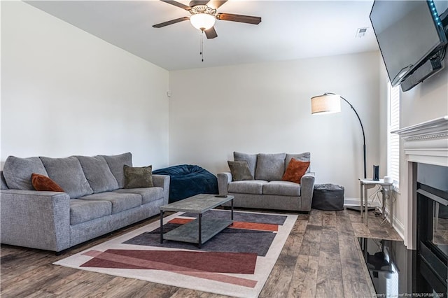 527 Weston Woods St, Raeford, NC 28376 - living room featuring ceiling fan, wood finished floors, and a fireplace