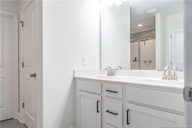 527 Weston Woods St, Raeford, NC 28376 - bathroom with double vanity and a shower with door