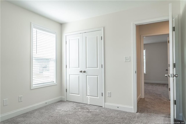 527 Weston Woods St, Raeford, NC 28376 - unfurnished bedroom featuring carpet floors, baseboards, and a closet