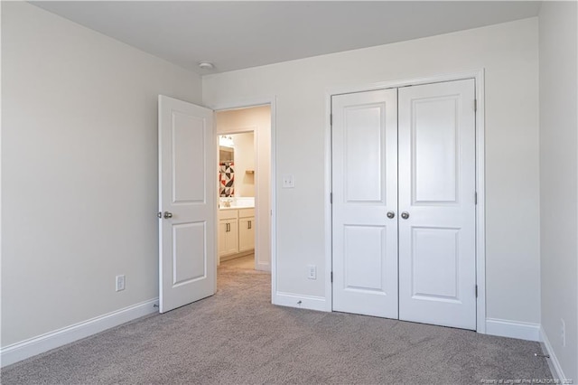 527 Weston Woods St, Raeford, NC 28376 - unfurnished bedroom with carpet flooring, baseboards, and a closet