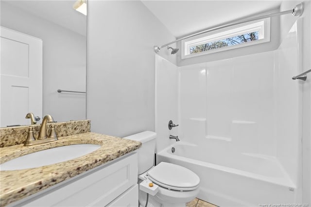 bathroom with toilet, vanity, and tub / shower combination