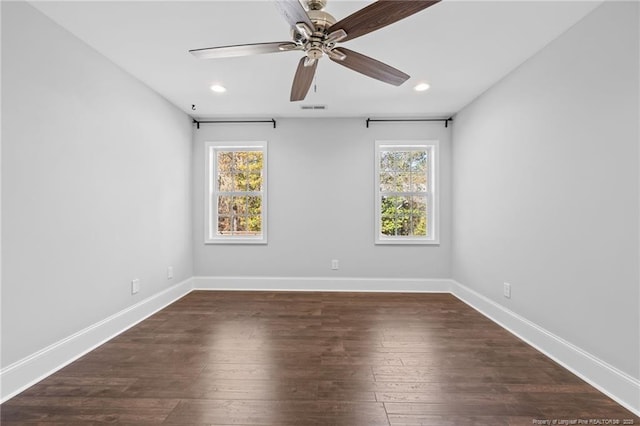empty room with ceiling fan, recessed lighting, baseboards, and dark wood-style floors