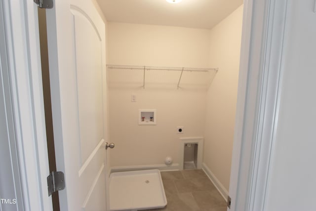 washroom featuring electric dryer hookup, washer hookup, and baseboards