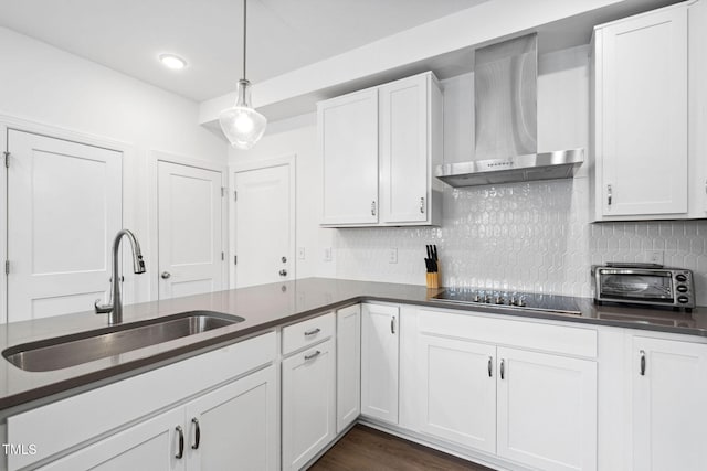 421 Wait Ave Unit 100, Wake Forest, NC 27587 - kitchen with wall chimney exhaust hood, a sink, dark countertops, white cabinetry, and black electric cooktop