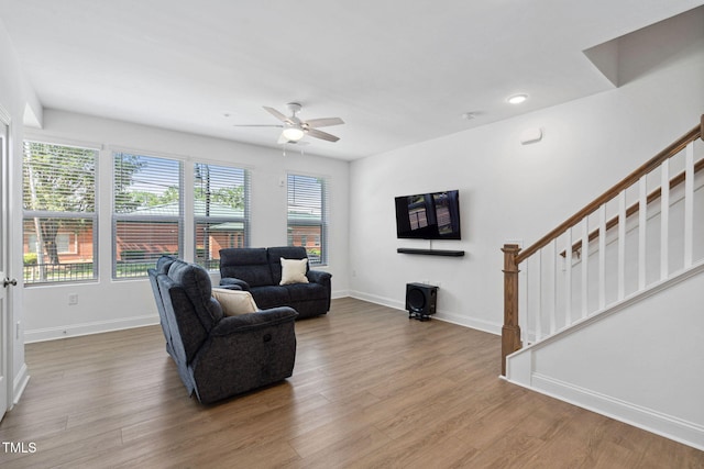 421 Wait Ave Unit 100, Wake Forest, NC 27587 - living room featuring stairway, plenty of natural light, baseboards, wood finished floors, and recessed lighting