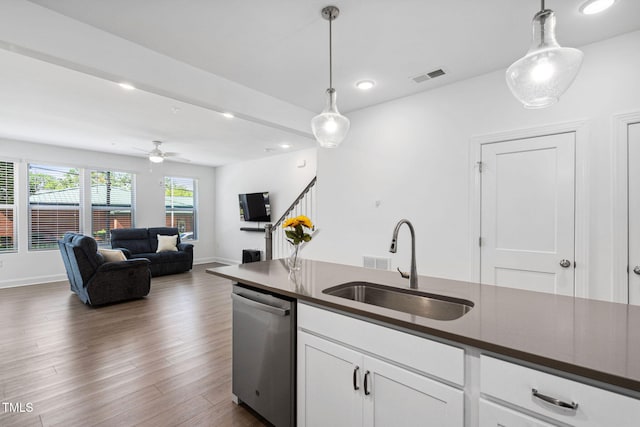 421 Wait Ave Unit 100, Wake Forest, NC 27587 - kitchen featuring dishwasher, dark countertops, a sink, hanging light fixtures, and recessed lighting