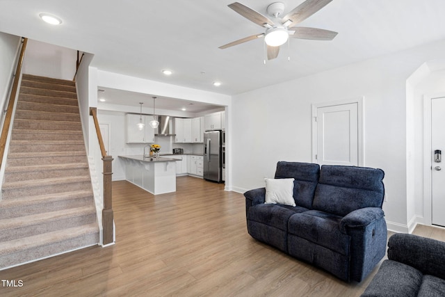 421 Wait Ave Unit 100, Wake Forest, NC 27587 - living area with light wood-type flooring, stairway, ceiling fan, baseboards, and recessed lighting