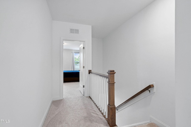 421 Wait Ave Unit 100, Wake Forest, NC 27587 - hall with an upstairs landing, carpet flooring, and baseboards