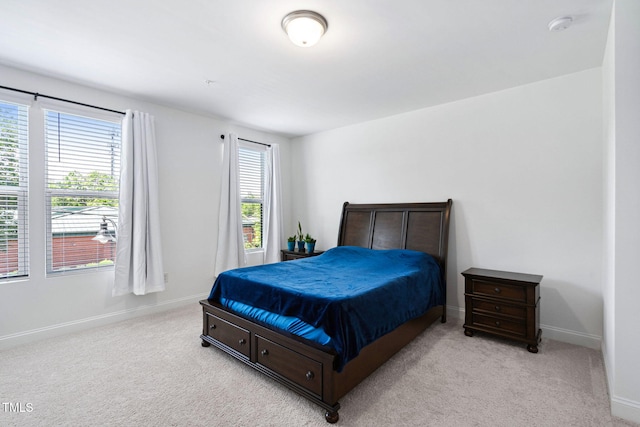 421 Wait Ave Unit 100, Wake Forest, NC 27587 - bedroom with light colored carpet and baseboards