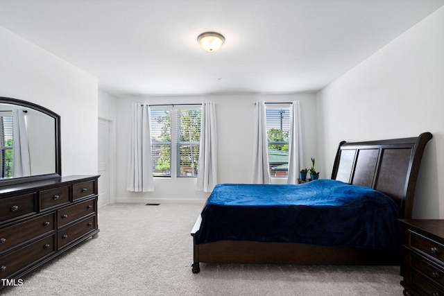 421 Wait Ave Unit 100, Wake Forest, NC 27587 - carpeted bedroom featuring baseboards