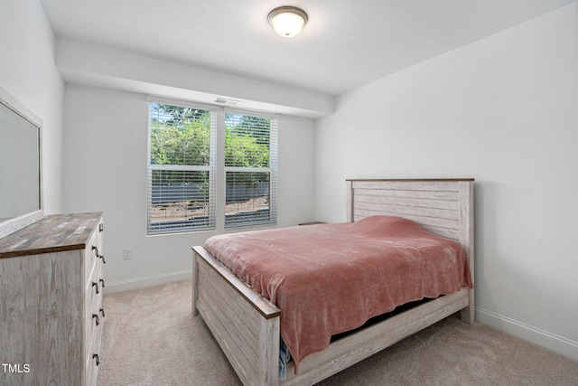 421 Wait Ave Unit 100, Wake Forest, NC 27587 - bedroom featuring light colored carpet and baseboards