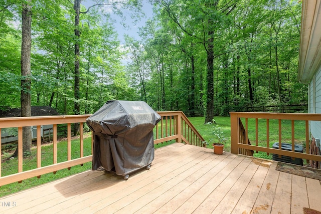 wooden deck featuring central AC and area for grilling