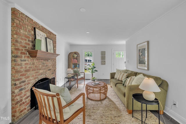 608 Cross Timbers Dr, Durham, NC 27713 - living area with wood finished floors, baseboards, a brick fireplace, ornamental molding, and recessed lighting
