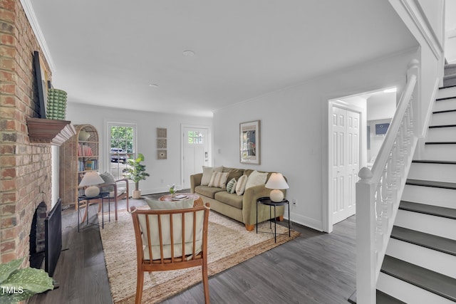 608 Cross Timbers Dr, Durham, NC 27713 - living room with a fireplace, stairs, dark wood-style floors, and baseboards