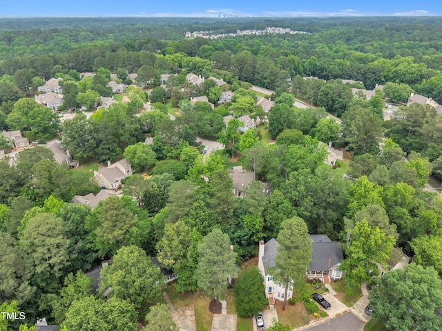 608 Cross Timbers Dr, Durham, NC 27713 - aerial overview of property's location with a heavily wooded area and nearby suburban area