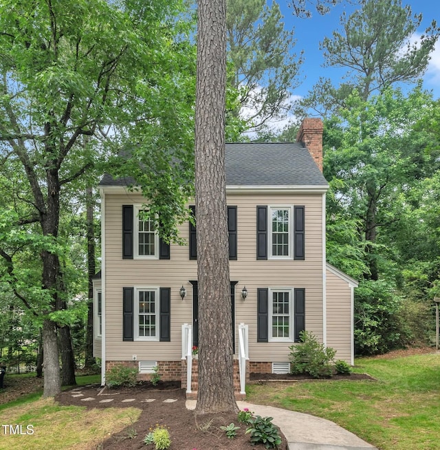 608 Cross Timbers Dr, Durham, NC 27713 - colonial-style house with a chimney and a front lawn