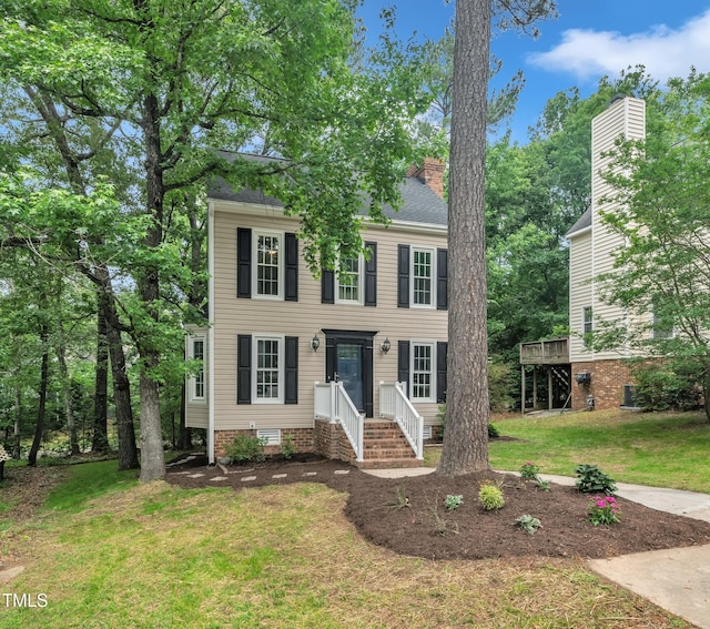 608 Cross Timbers Dr, Durham, NC 27713 - colonial inspired home with a front yard, a chimney, and crawl space