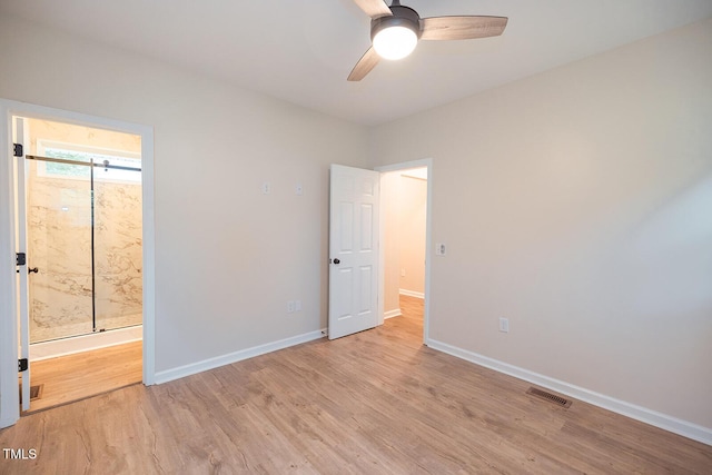 6 First St, Franklinton, NC 27525 - unfurnished bedroom with light wood finished floors, baseboards, connected bathroom, and ceiling fan