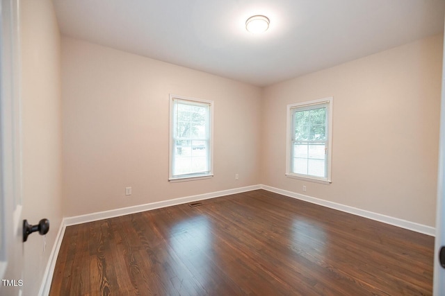 6 First St, Franklinton, NC 27525 - unfurnished room featuring healthy amount of natural light, baseboards, and dark wood-type flooring