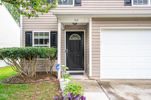 313 Weeping Willow Dr, Durham, NC 27704 - entrance to property with a garage