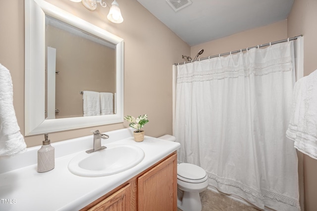 313 Weeping Willow Dr, Durham, NC 27704 - full bath featuring toilet, vanity, tile patterned flooring, and a shower with curtain