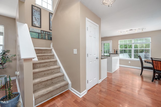 313 Weeping Willow Dr, Durham, NC 27704 - stairs with wood finished floors and baseboards