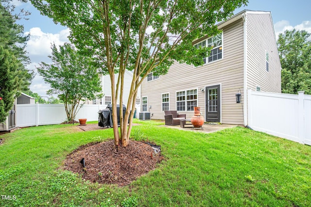 313 Weeping Willow Dr, Durham, NC 27704 - rear view of property featuring a patio and central air condition unit