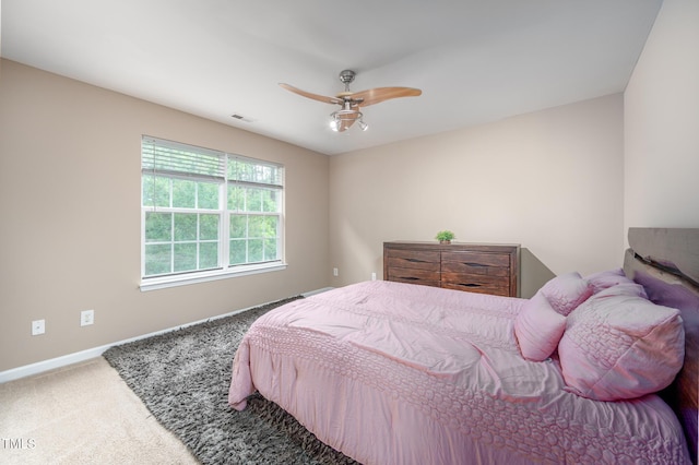 313 Weeping Willow Dr, Durham, NC 27704 - carpeted bedroom with baseboards and a ceiling fan
