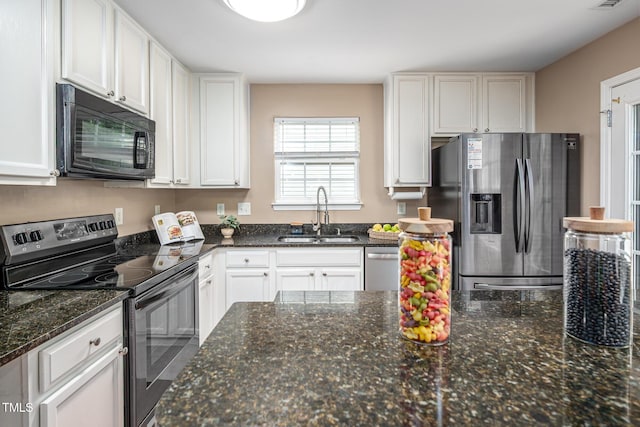 313 Weeping Willow Dr, Durham, NC 27704 - kitchen featuring black appliances, a sink, white cabinets, and dark stone countertops