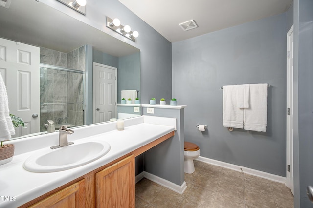 313 Weeping Willow Dr, Durham, NC 27704 - full bath featuring a shower stall, toilet, vanity, baseboards, and tile patterned floors