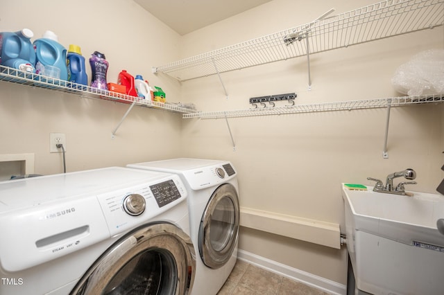 313 Weeping Willow Dr, Durham, NC 27704 - washroom featuring independent washer and dryer, light tile patterned floors, and baseboards