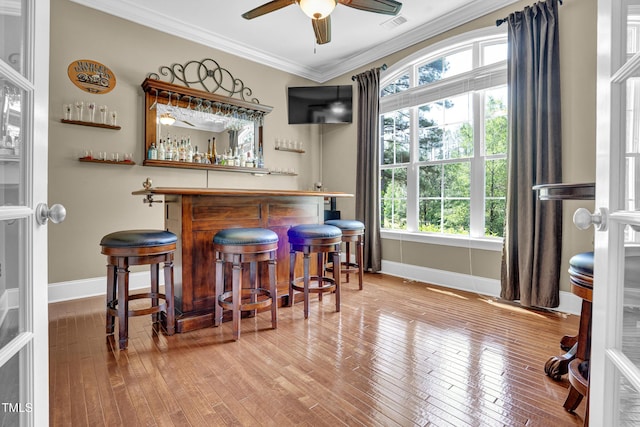 216 Colonial Ridge Dr, Pittsboro, NC 27312 - indoor dry bar featuring baseboards, crown molding, wood-type flooring, and ceiling fan