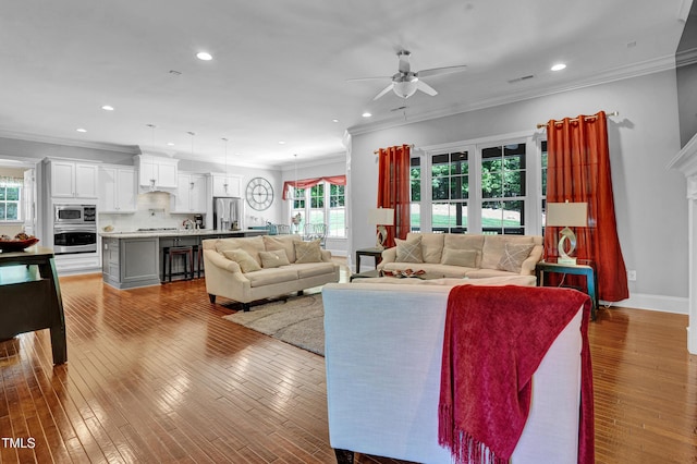 216 Colonial Ridge Dr, Pittsboro, NC 27312 - living room with ceiling fan, crown molding, recessed lighting, hardwood / wood-style flooring, and baseboards