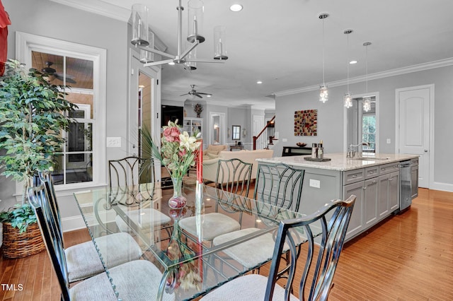 216 Colonial Ridge Dr, Pittsboro, NC 27312 - dining area featuring recessed lighting, crown molding, light wood-style floors, baseboards, and stairway