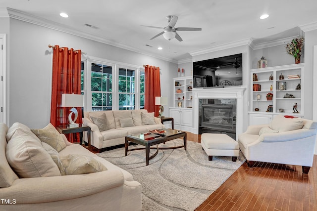 216 Colonial Ridge Dr, Pittsboro, NC 27312 - living area featuring a ceiling fan, recessed lighting, a high end fireplace, wood finished floors, and ornamental molding