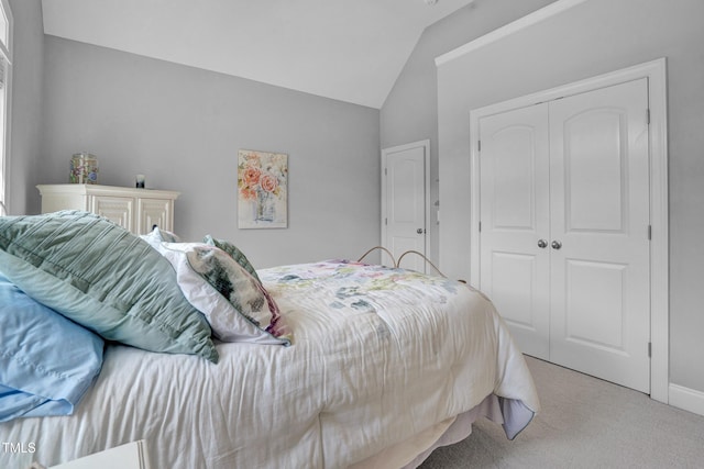 216 Colonial Ridge Dr, Pittsboro, NC 27312 - bedroom featuring lofted ceiling, carpet, a closet, and baseboards