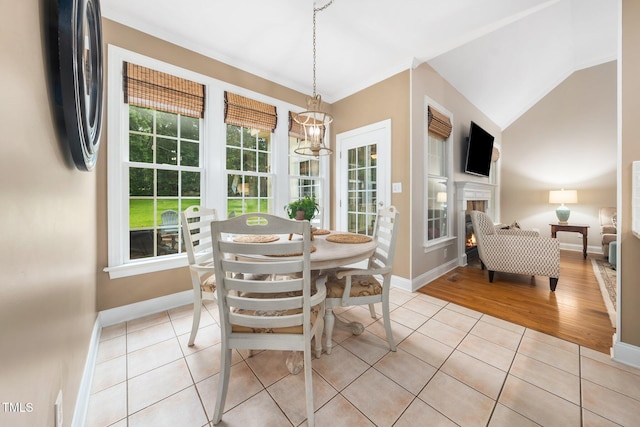 3916 Rustic Mill Dr, Apex, NC 27539 - dining space featuring light tile patterned floors, baseboards, and crown molding
