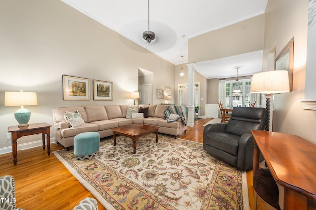 3916 Rustic Mill Dr, Apex, NC 27539 - living area with light wood finished floors, crown molding, baseboards, and high vaulted ceiling