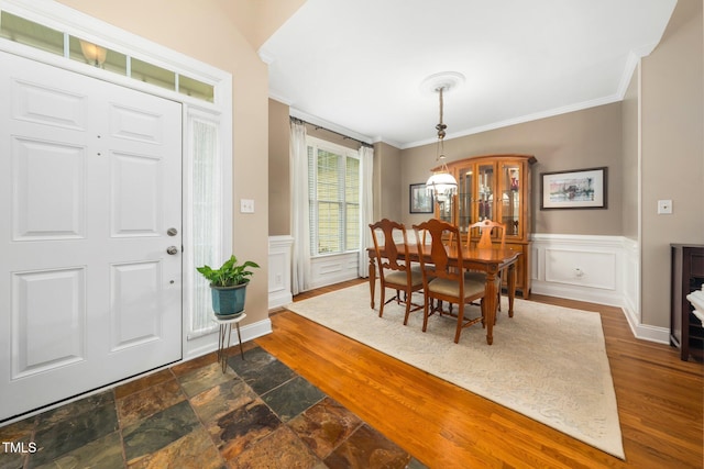 3916 Rustic Mill Dr, Apex, NC 27539 - dining space featuring crown molding, wainscoting, and a decorative wall