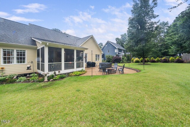 3916 Rustic Mill Dr, Apex, NC 27539 - view of grassy yard featuring a patio area, a fire pit, and a sunroom
