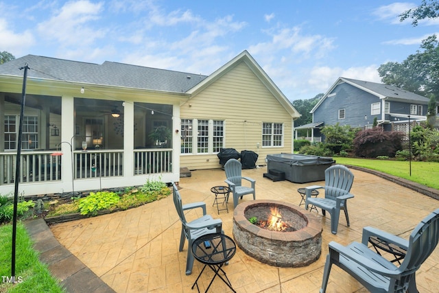 3916 Rustic Mill Dr, Apex, NC 27539 - view of patio / terrace with a hot tub, an outdoor fire pit, and a sunroom