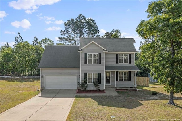 traditional home featuring driveway, an attached garage, and a porch