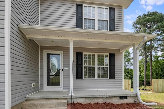 doorway to property with a porch