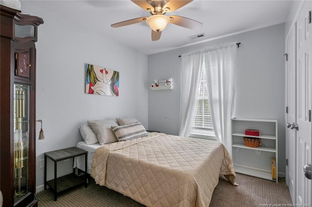 carpeted bedroom with a ceiling fan