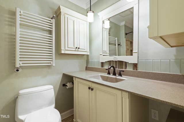 712 Beaver Dam Rd, Raleigh, NC 27607 - bathroom featuring radiator heating unit, ornamental molding, toilet, a towel warmer, and vanity