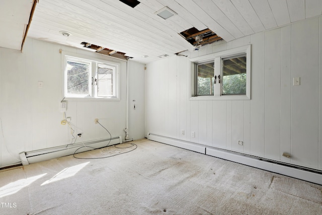 712 Beaver Dam Rd, Raleigh, NC 27607 - unfurnished room featuring a baseboard heating unit, wood ceiling, and carpet floors