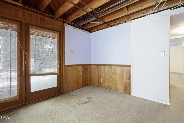 712 Beaver Dam Rd, Raleigh, NC 27607 - carpeted empty room with wooden walls and wainscoting