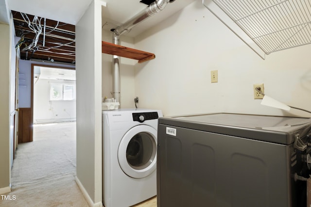 712 Beaver Dam Rd, Raleigh, NC 27607 - laundry room featuring washer and clothes dryer and light colored carpet