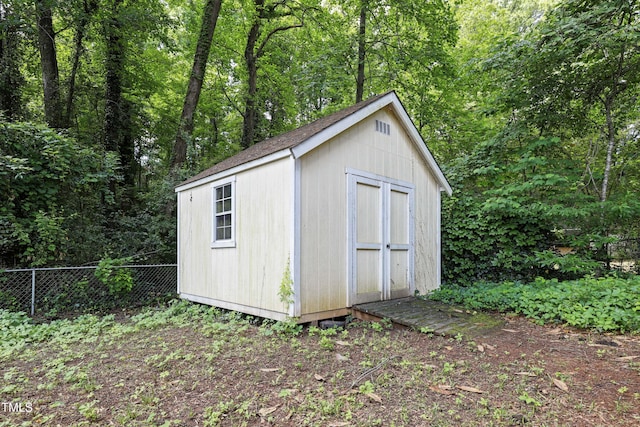 712 Beaver Dam Rd, Raleigh, NC 27607 - view of shed with fence and a wooded view