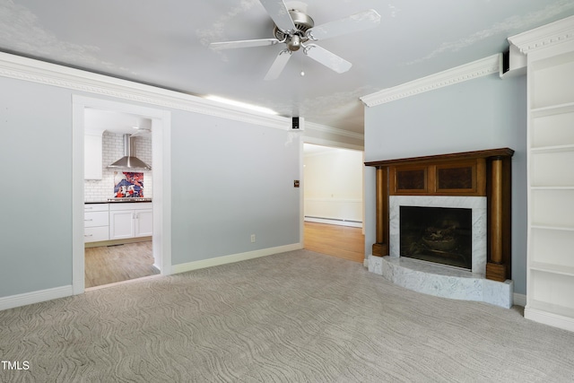 712 Beaver Dam Rd, Raleigh, NC 27607 - unfurnished living room featuring a high end fireplace, carpet flooring, a ceiling fan, baseboards, and ornamental molding